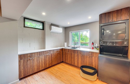Lincoln Park House | Game Room & Yard: Mid-Century Modern Kingston Home