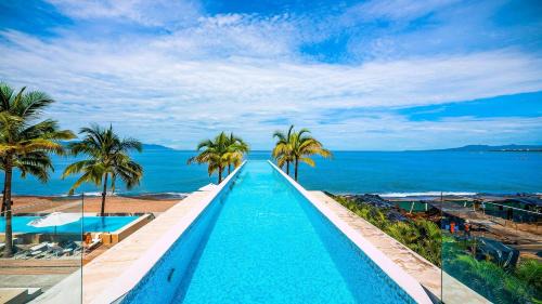 Las Glorias Apartment | Gorgeous 1BR Condo with Pools & Sea Views