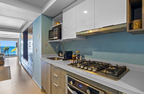Las Glorias Apartment | Gorgeous 1BR with Pools & Sea Views