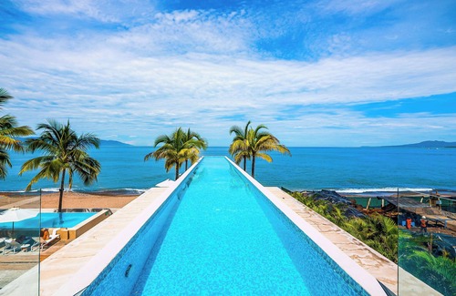 Las Glorias Apartment | Gorgeous 1BR with Pools & Sea Views