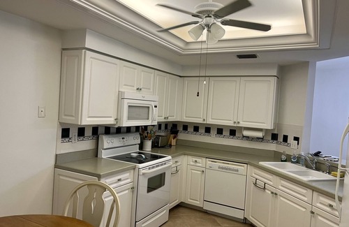 North Naples Condo | GORGEOUS - LAKEFRONT CARRIAGE HOME-1ST FLOOR LIVING-2 BED/2 BATH-2 POOLS