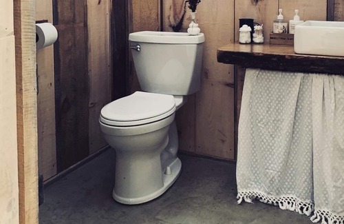 Boscawen RV Rental | Handcrafted, off-grid, no electricity-rustic-lux camping cabin w/running water.