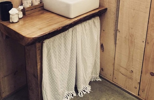 Boscawen RV Rental | Handcrafted, off-grid, no electricity-rustic-lux camping cabin w/running water.