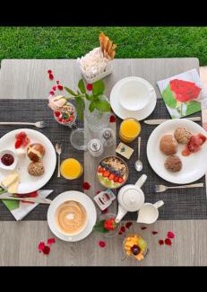 Caldaro Sulla Strada del Vino Apartment | Haus Gregori Modern & Central Stay in Vineyard with Rooftop & Served Breakfast
