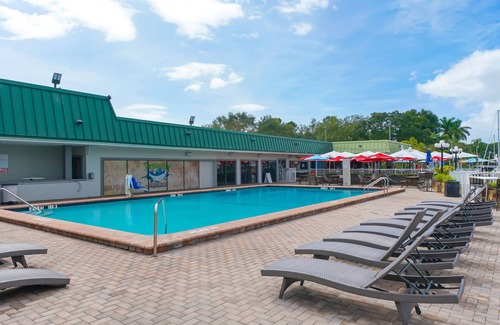 Trailer Estates Apartment | Heated Pool, Fireplace, 70" TV, Marina Front, Tiki Bar and Grill