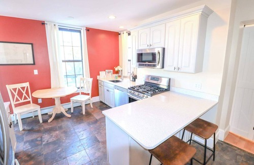 Pond Cove Condo | Historic Brick Corner Apartment, off street parking