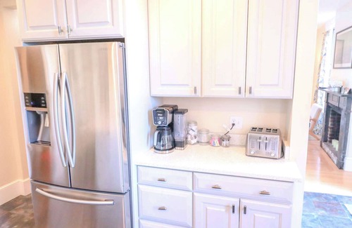 Pond Cove Condo | Historic Brick Corner Apartment, off street parking