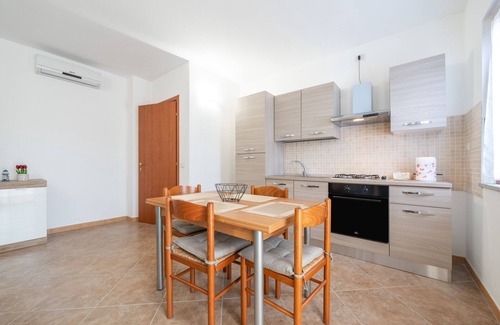 Masainas Apartment | Holiday Apartment "Is Lais 3" with Sea View, Shared Garden & Wi-Fi