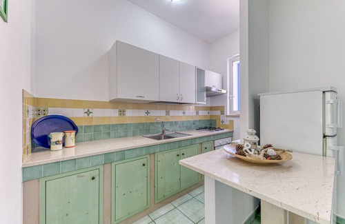 Marina di Novaglie Apartment | Holiday Home 'Il Carrubo Orchide' with Private Terrace, Private Garden and Balcony