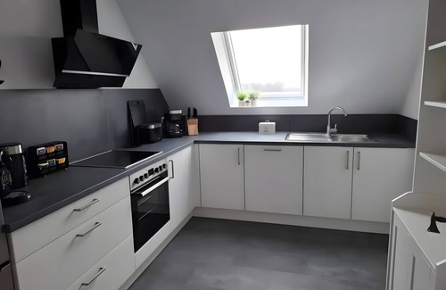 Friedrichskoog House | Holiday Home 'Timeout' with Private Terrace, Garden on the Canal, and Wi-Fi