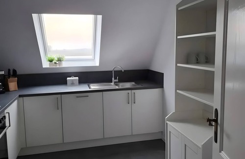 Friedrichskoog House | Holiday Home 'Timeout' with Private Terrace, Garden on the Canal, and Wi-Fi