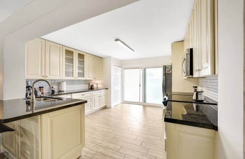 Melaleuca Gardens House | Home on Canal unit A by PMI