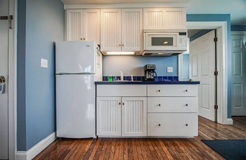 Falmouth Condo | Hot tub on your deck and beach across the street.Relax