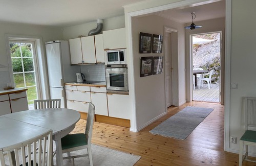 Stromstad House | House with a light interior, on a little island