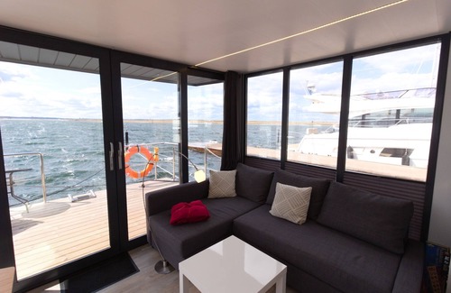 Wendtorf Boat Rental | Houseboat Fjord Auriga with bio sauna and roof terrace in Wendtorf/Kiel Fjord