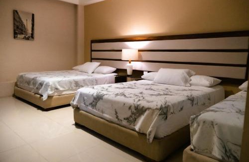 Alfredo V. Bonfil Apartment | Infinity Suites habitación triple