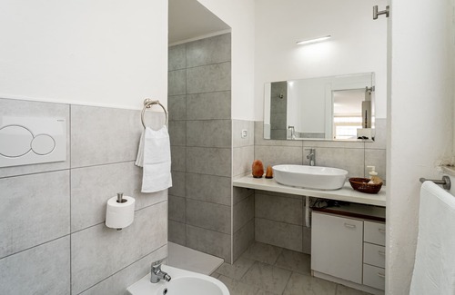 Carbonia House | Intimate, quiet studio apartment with a small living room and equipped kitchen