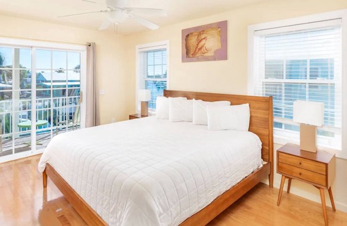 Long Key Hotel | Island Retreat 3BR: Canal Views, Full Kitchen, Private Pool & Paddle Board Fun!