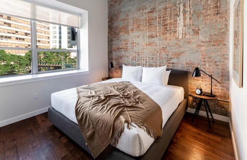 Central Business District Apartment | Kislak 507 Stunning 2BR with Den Corner Apt Retreat Above the City