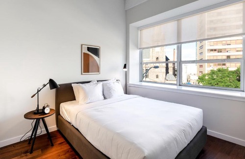 Central Business District Apartment | Kislak 507 Stunning 2BR with Den Corner Apt Retreat Above the City