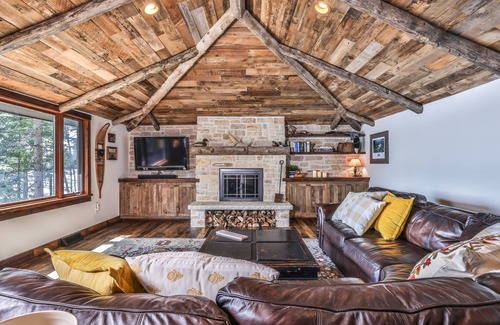 Presque Isle Cabin | Lakefront home on snowmobile trail with kayaks/SUP, fireplace, game room & AC