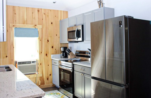 Laconia Cottage | Lakefront home with a deck, gas grill, WiFi, dock & golf nearby
