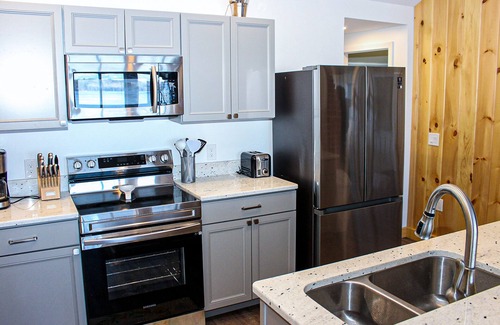 Laconia Cottage | Lakefront home with a deck, gas grill, WiFi, dock & golf nearby