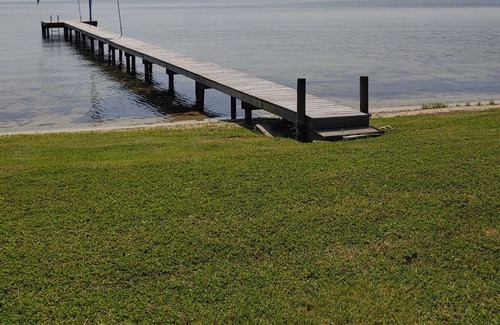Sebring House | Lakefront private home with beach, dock and party area and large back yard