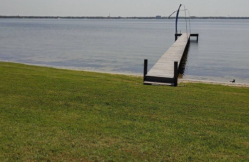 Sebring House | Lakefront private home with beach, dock and party area and large back yard