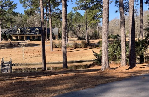 Hattiesburg House | Lakeside pavilion on private lake with a boathouse, outdoor fireplace, kayaks.