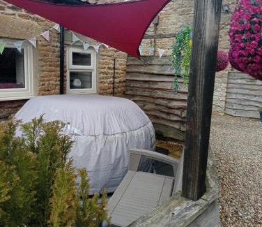Wykeham House | Larch Cottage Ruston with hot tub, dogs go free