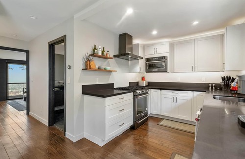 Claremont Hills House | Live in luxury in this meticulously updated 3BR/3BA Claremont Heights mid-century modern home w/AC.