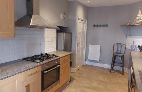 Penrhyn Bay Apartment | Llandudno apartment, quirky pub with tropical beer garden