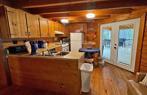 McCormick Cabin | Log Cabin with large deck and dock in best location on the Lake!