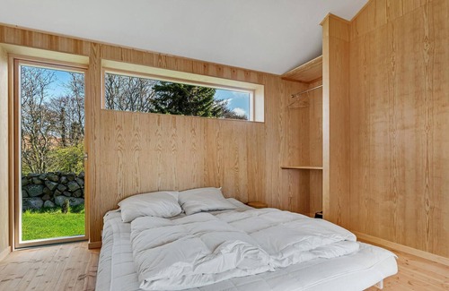 Vang House | Look forward to your vacation in this modern vacation home with sea view.