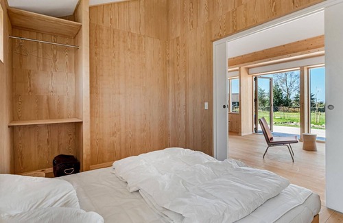 Vang House | Look forward to your vacation in this modern vacation home with sea view.