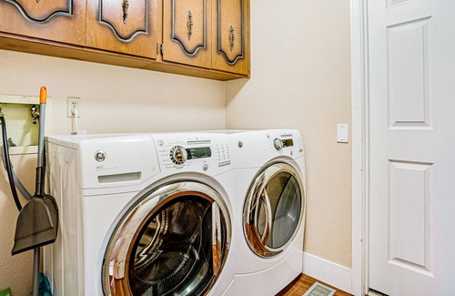 University Place House | Lovely home with nearby beach access, patio, hammock and washer/dryer