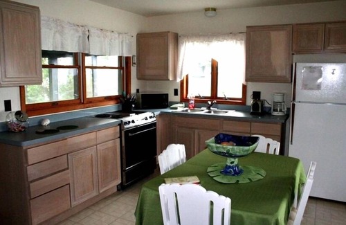 Wolcott Cottage | Lure Cottage, Right on the beech. Palm Trees, Free Motor Boat.