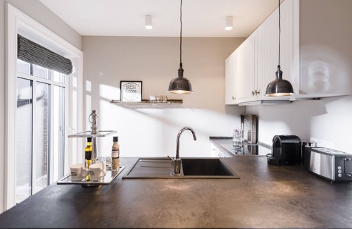 Loddin Apartment | Luxurious apartments with daily Cleaning, fireplace, water view, laundry incl.