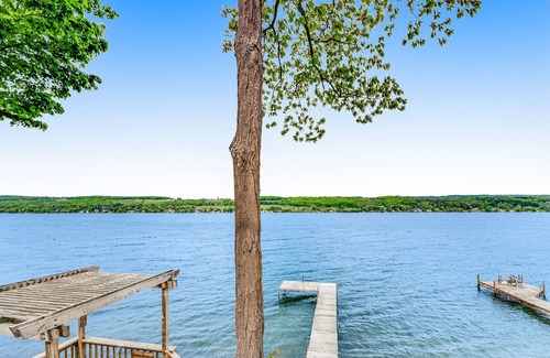 Town of Milo House | Majestic lakefront dog-friendly home with game room, fireplace, partial AC