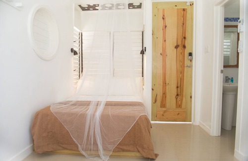 West End Resort | Mango Rooms at Begona is a cliffside hotel with stunning Caribbean sunset views