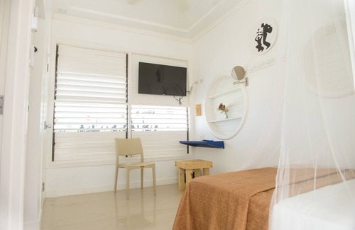West End Resort | Mango Rooms at Begona is a cliffside hotel with stunning Caribbean sunset views