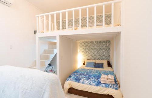 Maejima House | Maximum of 21 people can be rented in one building 3 minutes walk to Tomari Port 10 minutes drive to the airport No parking lot 30 seconds walk from paid parking lot warayunso port city May