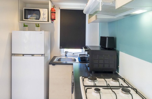 Seignosse RV Rental | Mobile Home 'Camping Les Oyats' with Shared Pool, Private Terrace and Private Garden