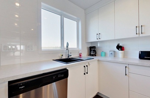 Red Deer House | Modern 4 Bedroom House for 8 Guests in Red Deer ~ Games Room, Fire Pit, A/C, BBQ