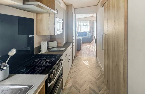 Bleadon House | Modern and contemporary 12ft-wide caravan with one double and two twin.