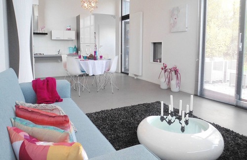 Municipality of Langedijk Ski Chalet | Modern chalet with a fireplace in a holiday park