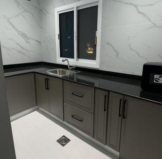 Al Koudh Apartment | Modern Cozy Apartment with Elegant Gray Design & Smart Lighting