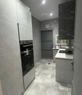 Al Koudh Apartment | Modern Cozy Apartment with Elegant Gray Design & Smart Lighting
