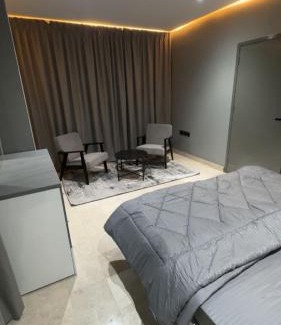 Al Koudh Apartment | Modern Cozy Apartment with Elegant Gray Design & Smart Lighting